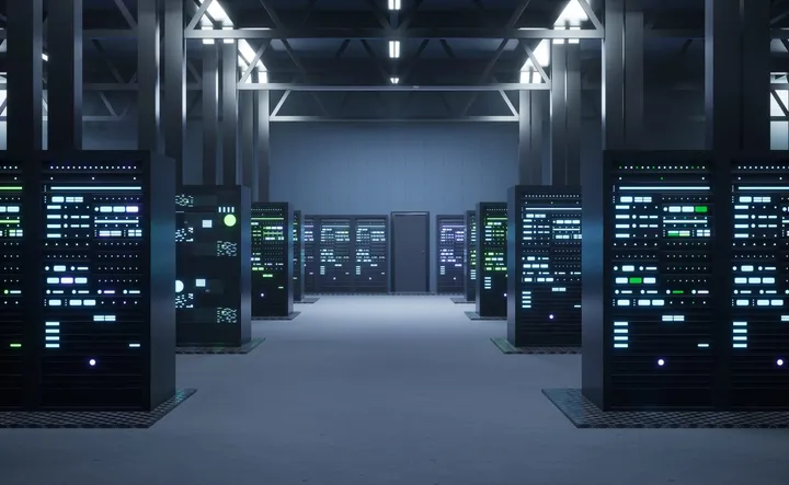 Rows of illuminated server racks in a data centre